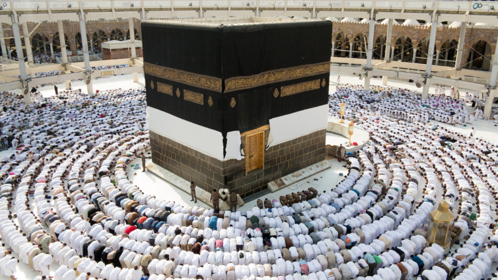 Showing Equality and Unity of Muslims during Hajj. AN image of Kabba and Muslims are gathered around. Showing Equality and Unity of Muslims during Hajj. AN image of Kabba and Muslims are gathered around.